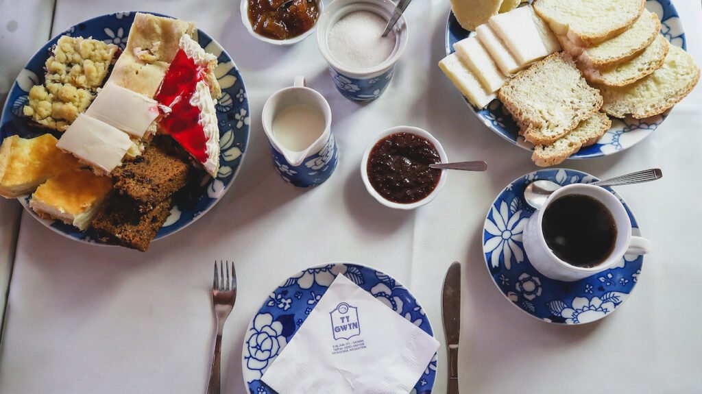 A Welsh afternoon tea with various cakes and breads in Gaiman.