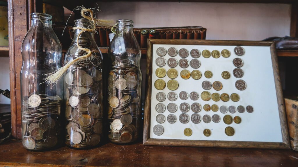 Old coin collection at Museo Bar La Legal in Cholila, Chubut