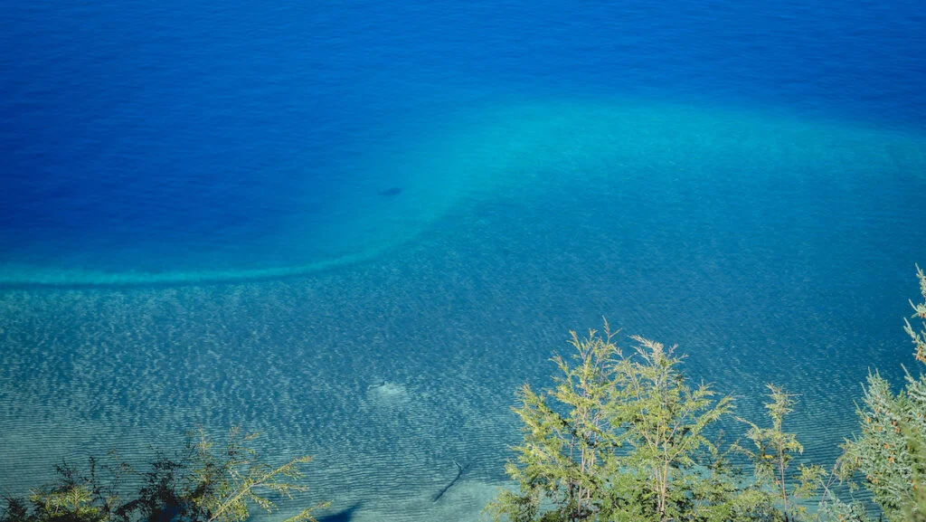 The turquoise waters of Nahuel Huapi Lake on the 7 Lakes Road The turquoise waters of Nahuel Huapi Lake on the 7 Lakes Road