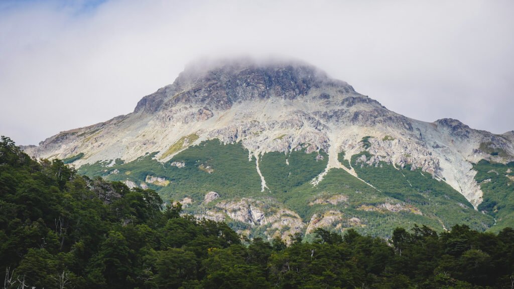 Mountain peaks in Los Alerces covered by low clouds