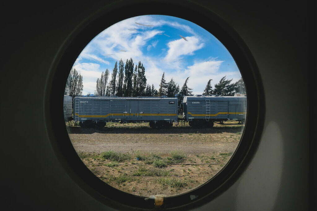 Looking out from a circular train window on the Tren Patagonico.
