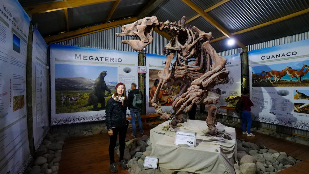 Audrey standing next to a megatherium skeleton, a giant sloth that roamed Patagonia up until the arrival of man 