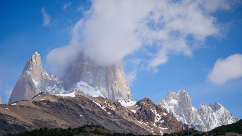 Cerro Torre's granite peak covered by clouds in El Chalten, Patagonia.