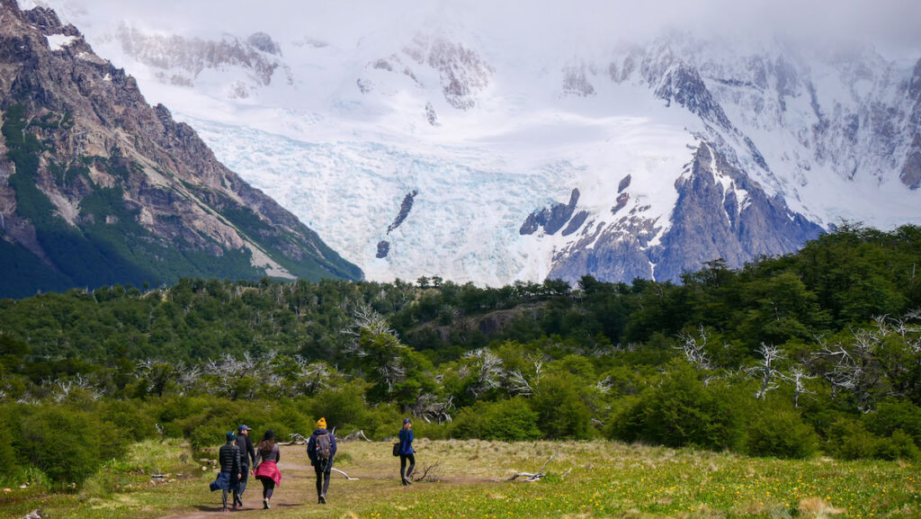The hiking trail to Cerro Torre in El Chalten. You can see a glacier and the mountain covered by clouds. 