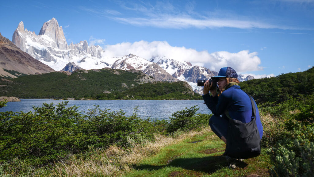 Taking photos on the shores of Laguna Capri while on a day hike in El Chalten 