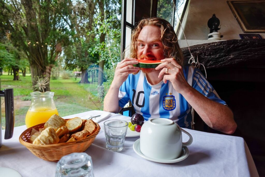 Sam eating watermelon for breakfast at La Cinacina, Areco