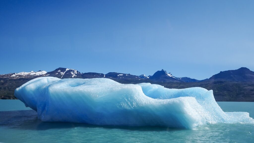 Blue iceberg floating in Lago Argentino in Los Glaciares National Park 