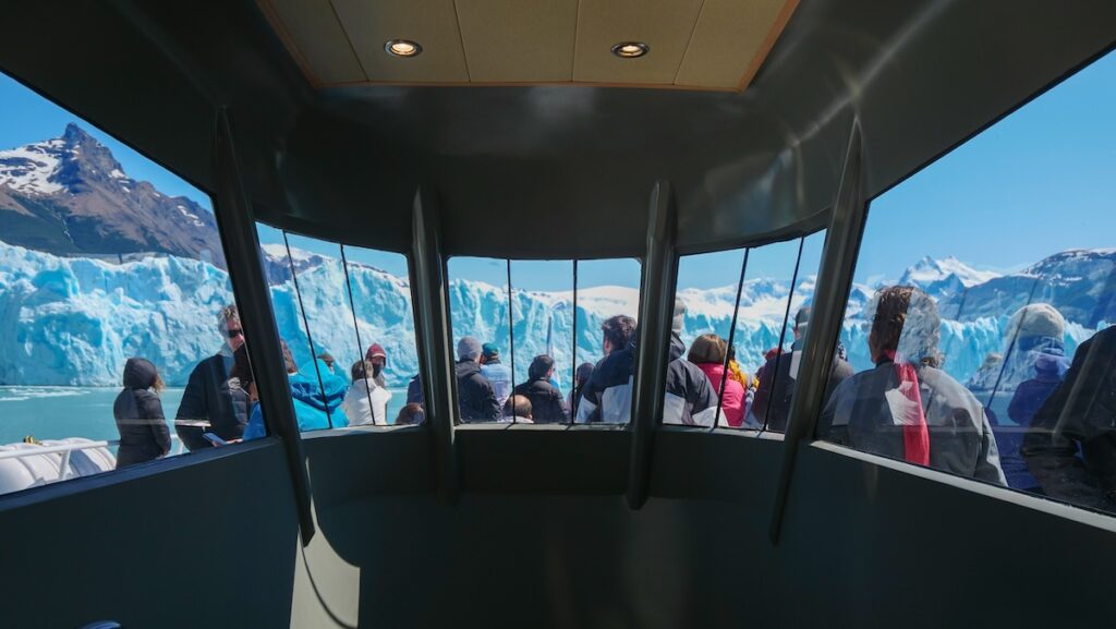 Passengers on the deck of Maria Turquesa glacier cruise in Los Glaciares National Park 