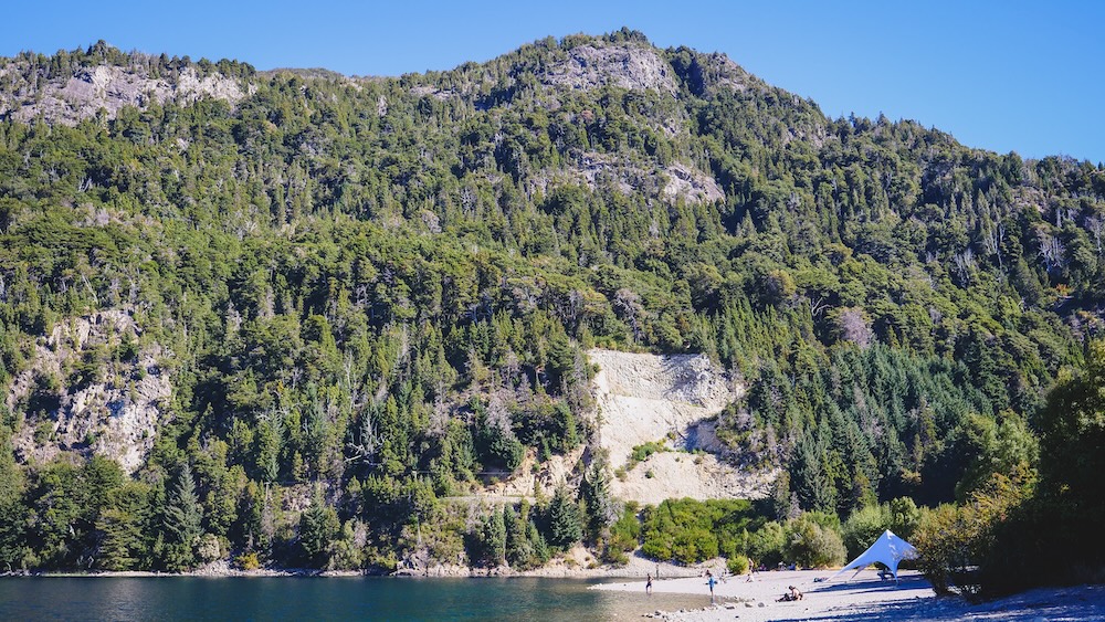 The pebbly beach at the foot of a mountain in Colonia Suiza, Rio Negro 