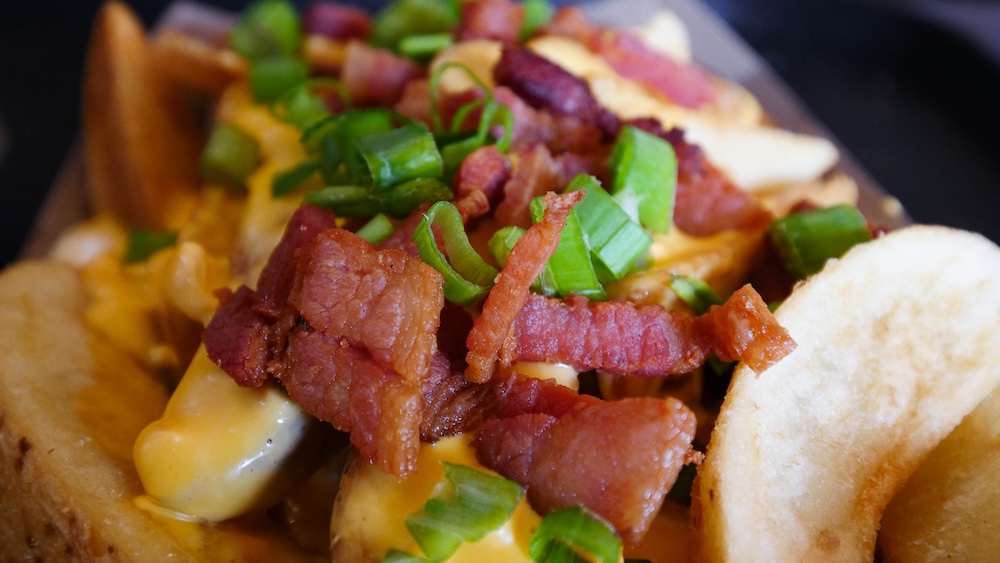 Loaded potatoes with melted cheese and bacon at a brewery in Bariloche 