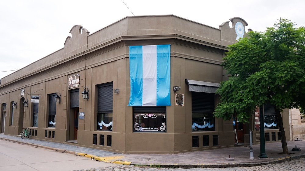 Argentine flag draped on a building in San Antonio de Areco, Buenos Aires