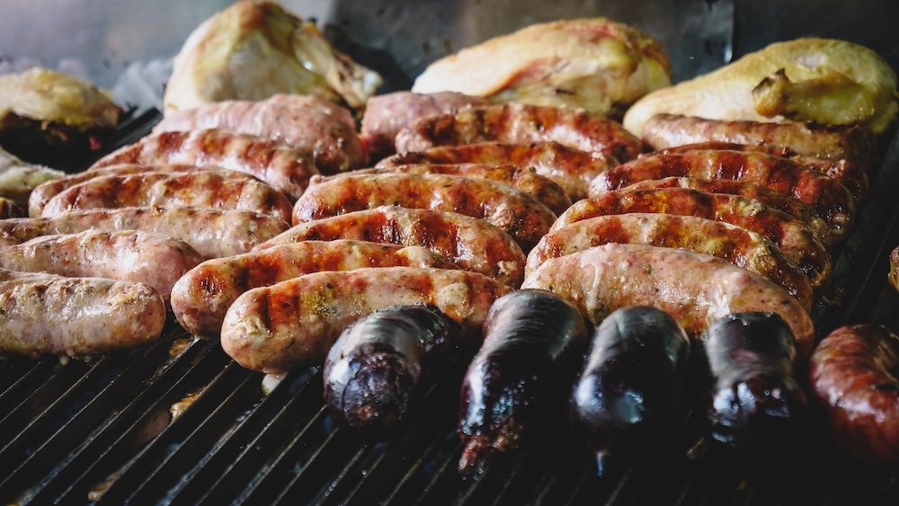 Chorizo and morcilla on the grill at an Argentine asado
