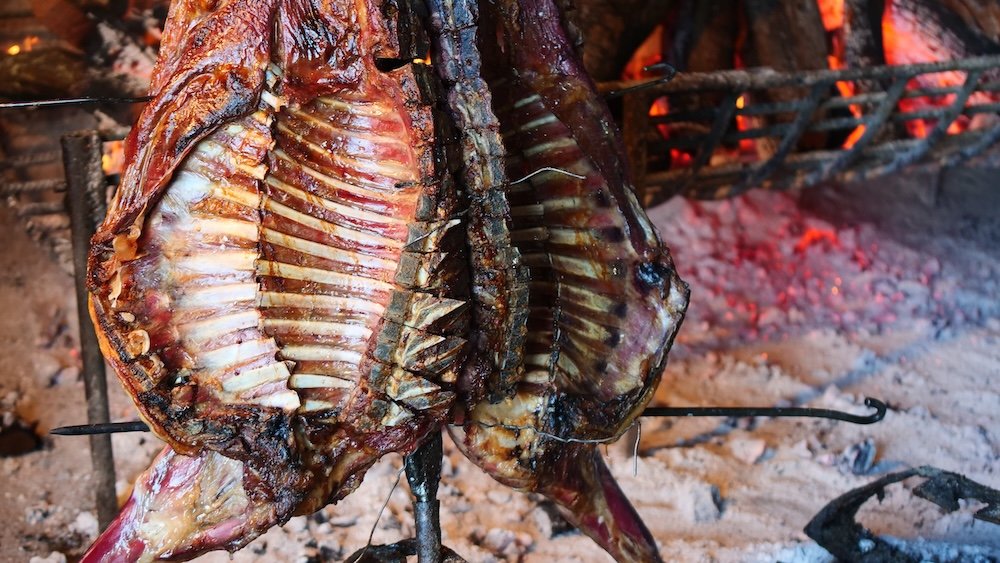 Cordero patagónico is slow-roasted Patagonian lamb cooked over an open fire.