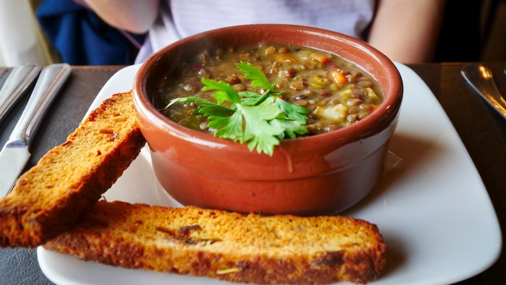 Guiso de lentejas is a lentil stew with chorizo and bacon, and it is typically served in a clay pot. It is one of my favourite traditional Argentine dishes.