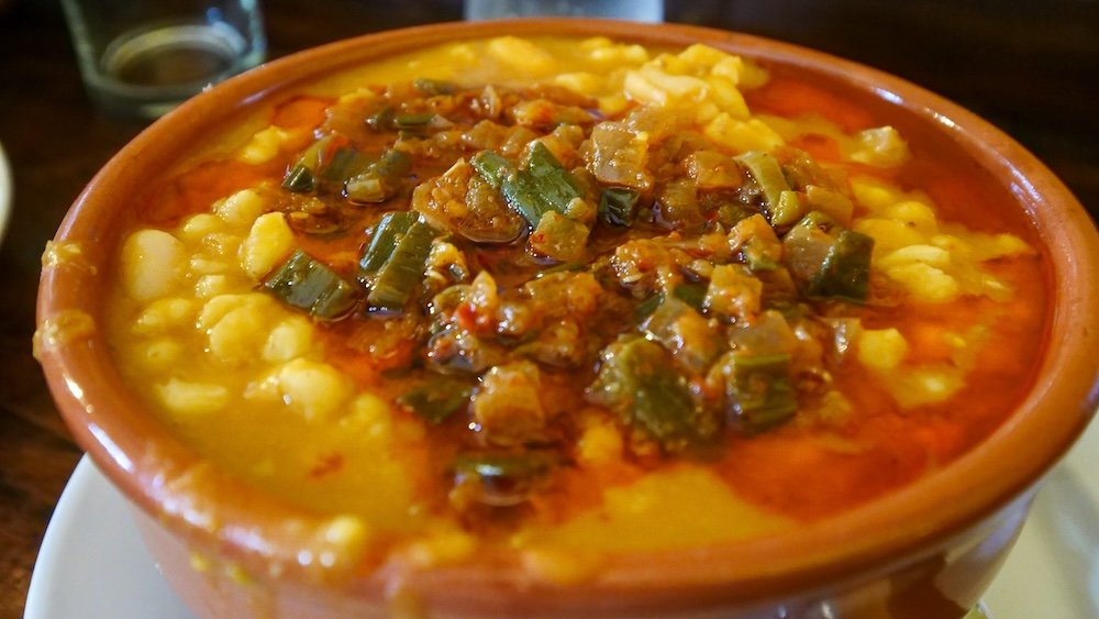 Locro is a corn, meat, bean and vegetable stew that's served in a clay pot and eaten on Argentina's national holidays.