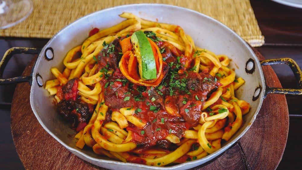 Fideos or tallarines refer to noodles, and tuco to the rich tomato sauce that goes with them