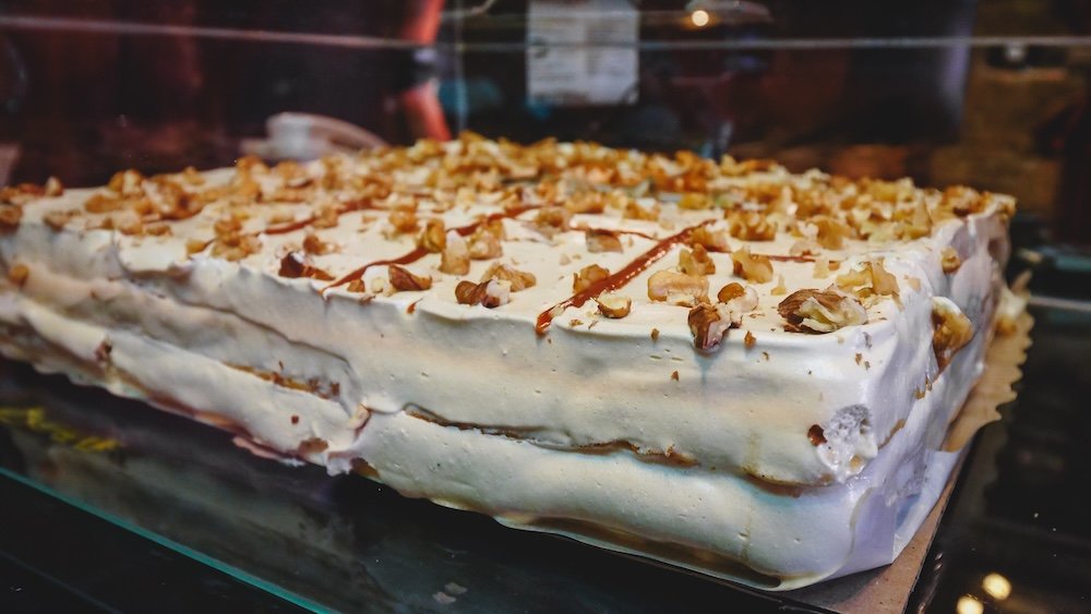 Torta Rogel is a cake with layers of crispy pastry and dulce de leche in between. The whole cake is then coated in meringue.
