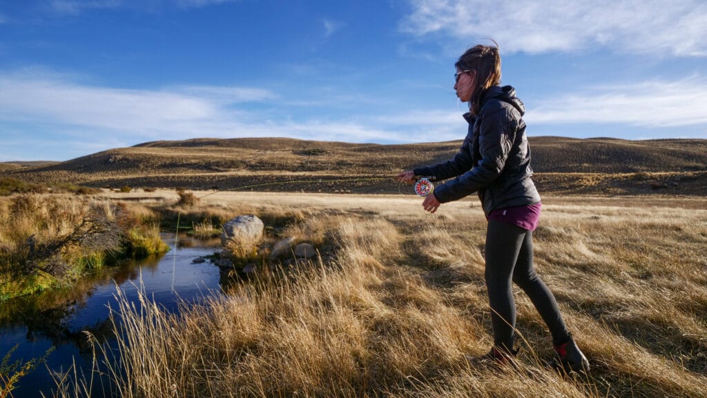 Audrey Bergner, founder of Che Argentina Travel, fly fishing on the Corcovado River at Estancia Tecka, documenting the logistical requirements for specialized trekking and fishing in Patagonia.
