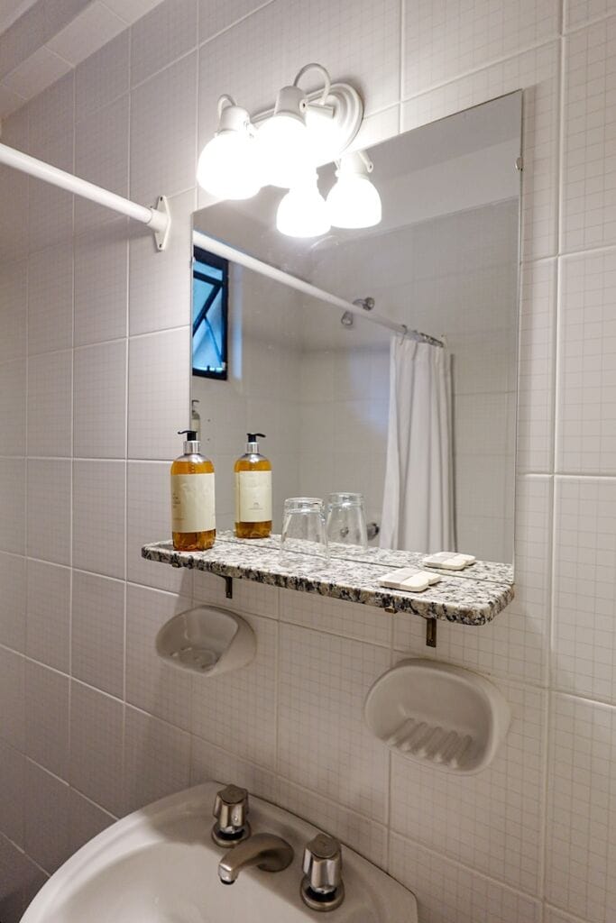 Sink, mirror and soaps in our hotel bathroom