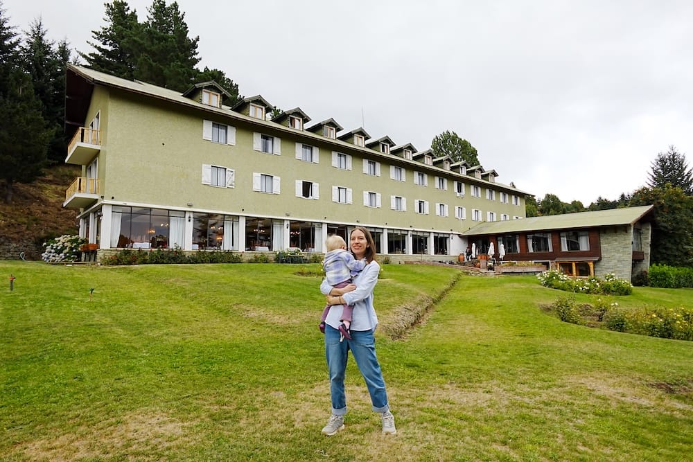 Audrey and Aurelia standing in the gardens with Gran Hotel Panamericano in the background.