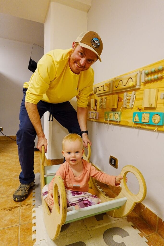Samuel and Aurelia in the hotel's Kids Room featuring lots of fun Montessori-style toys