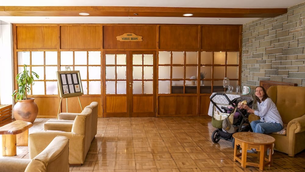 Audrey sitting in the hotel lobby in one of the many sitting areas.