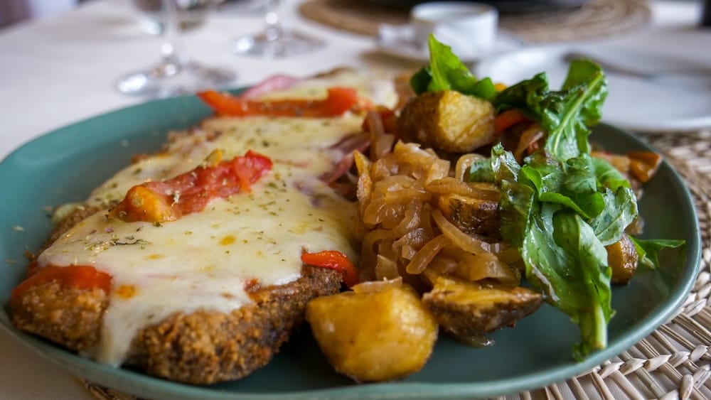 Milanesa a la napolitana with potatoes for dinner