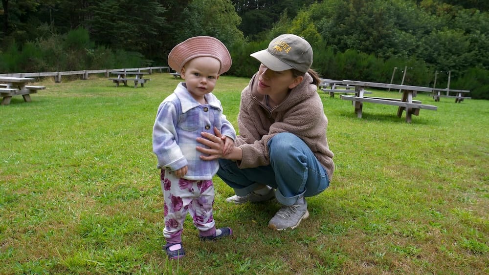 Audrey and Aurelia playing on a grassy field near the hotel in Puerto Blest.
