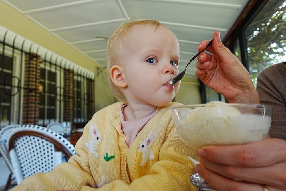 Aurelia eating vanilla ice cream for dessert.