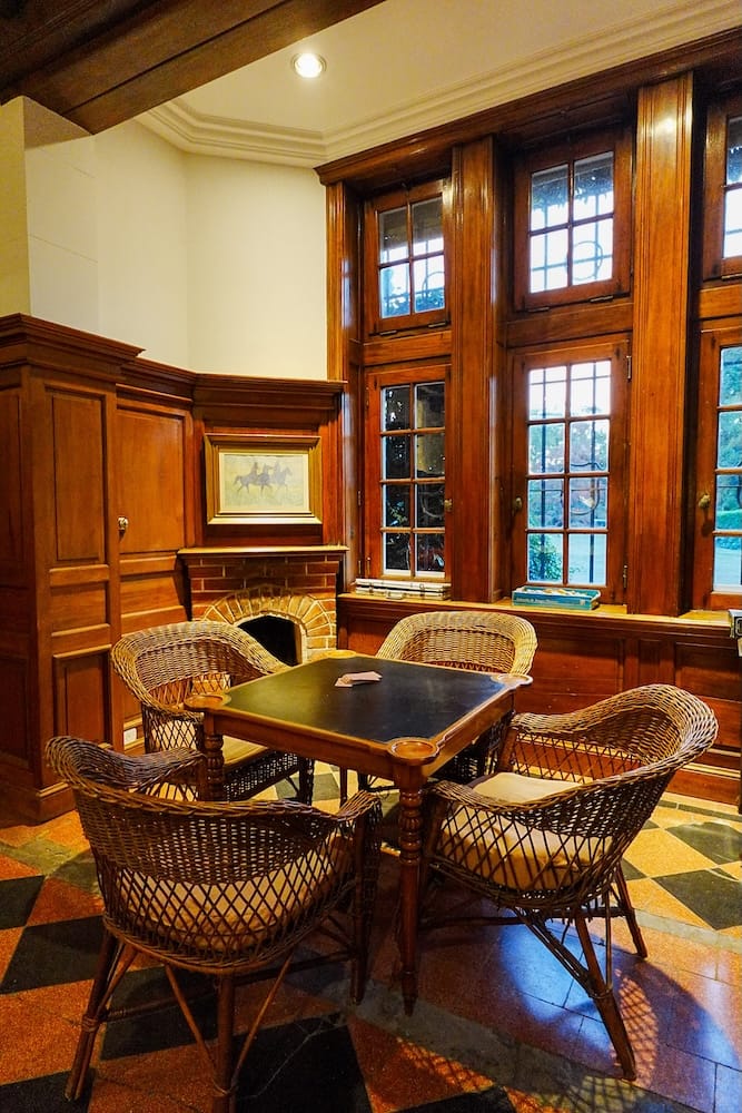 There is a game room with stacks of board games for the guests to enjoy.