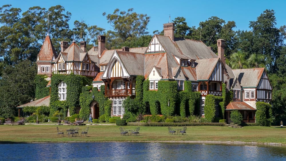 Estancia Villa Maria with its Norman Tudor architectural details as seen from the lagoon.