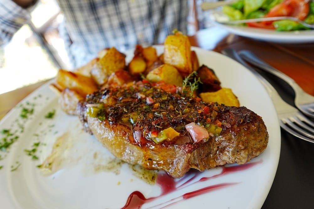 Steak with chimichurri and roasted potatoes for lunch at Estancia Villa Maria.