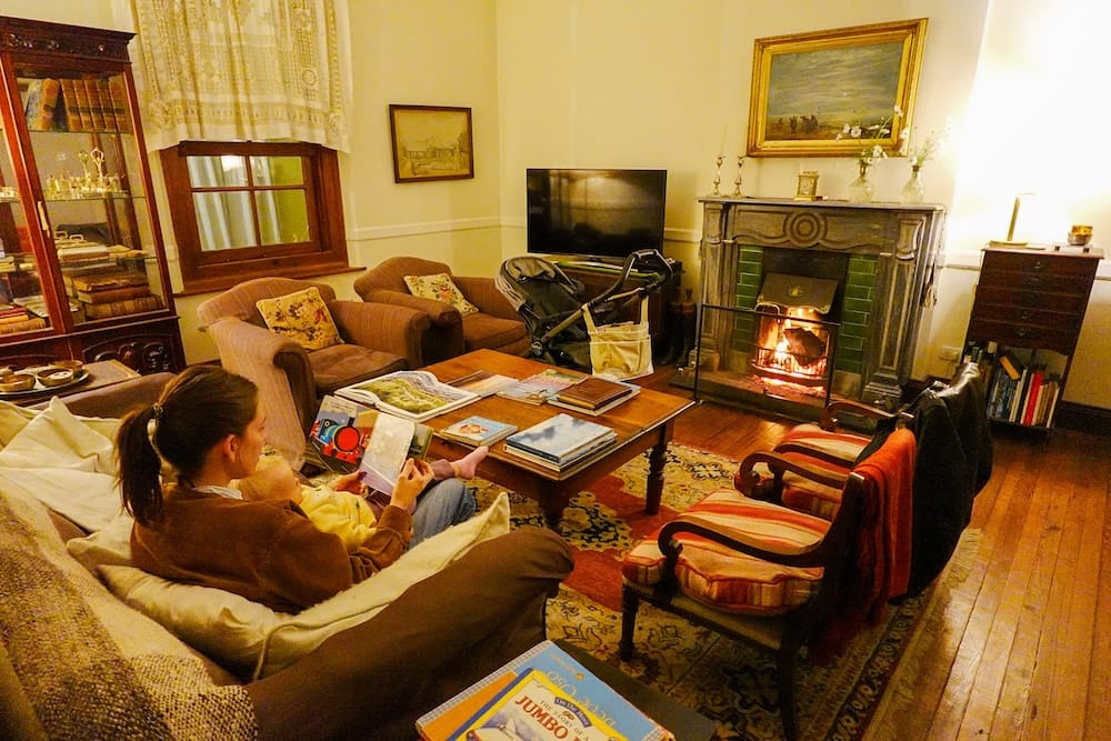 Cozy evening in front of the fireplace reading our daughter storybooks.
