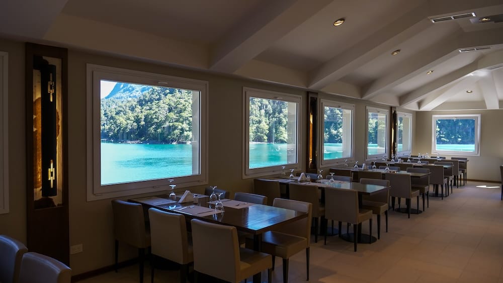 The main restaurant at Hotel Puerto Blest offers lake views.