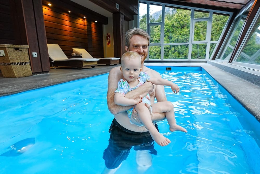 Samuel and Aurelia in the heated swimming pool in Hotel Puerto Blest, Bariloche, Argentina.