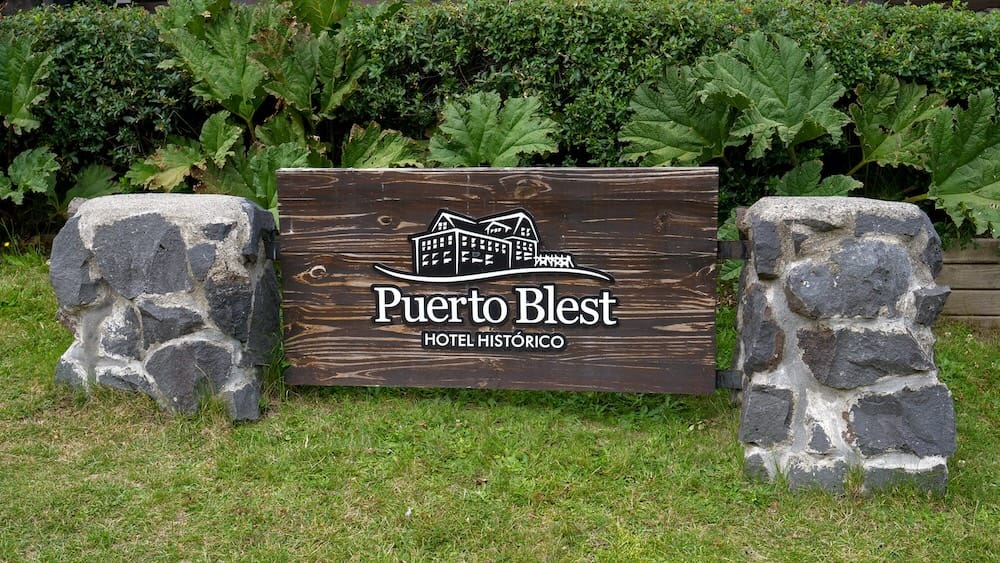 Wooden sign indicating this is a historic hotel in Puerto Blest.