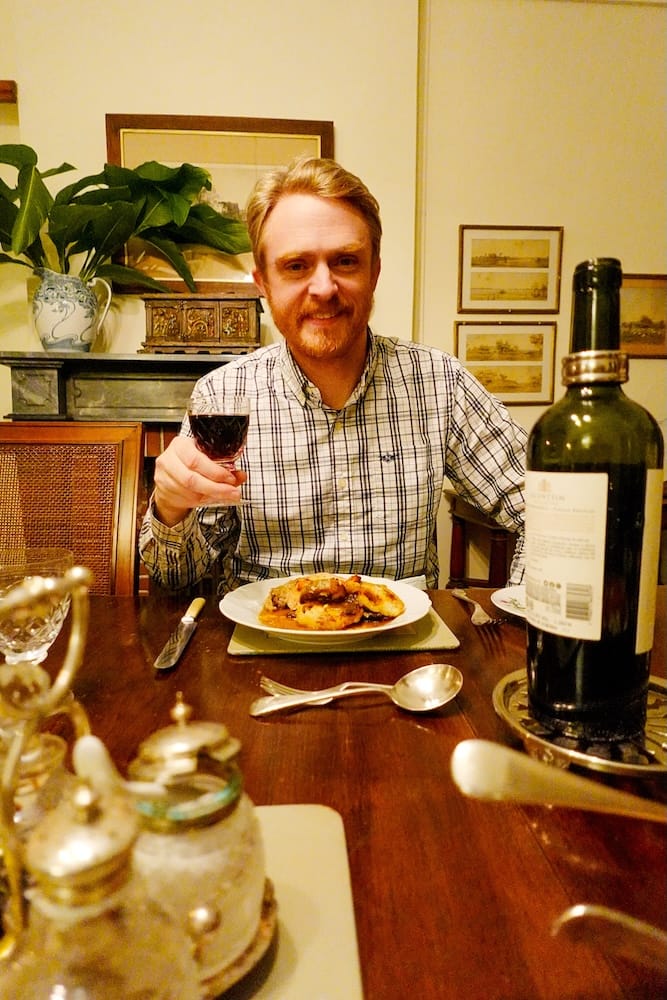 Sam enjoying a glass of Malbec wine at dinner.