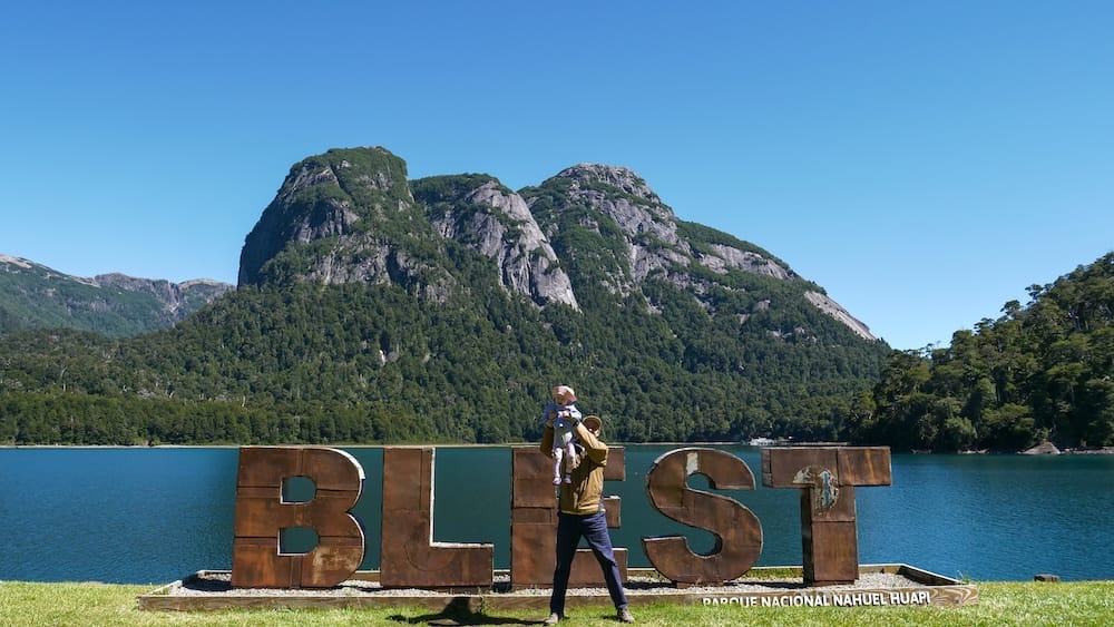 Samuel holding Aurelia up for her 'Lion King' moment in front of the BLEST sign.