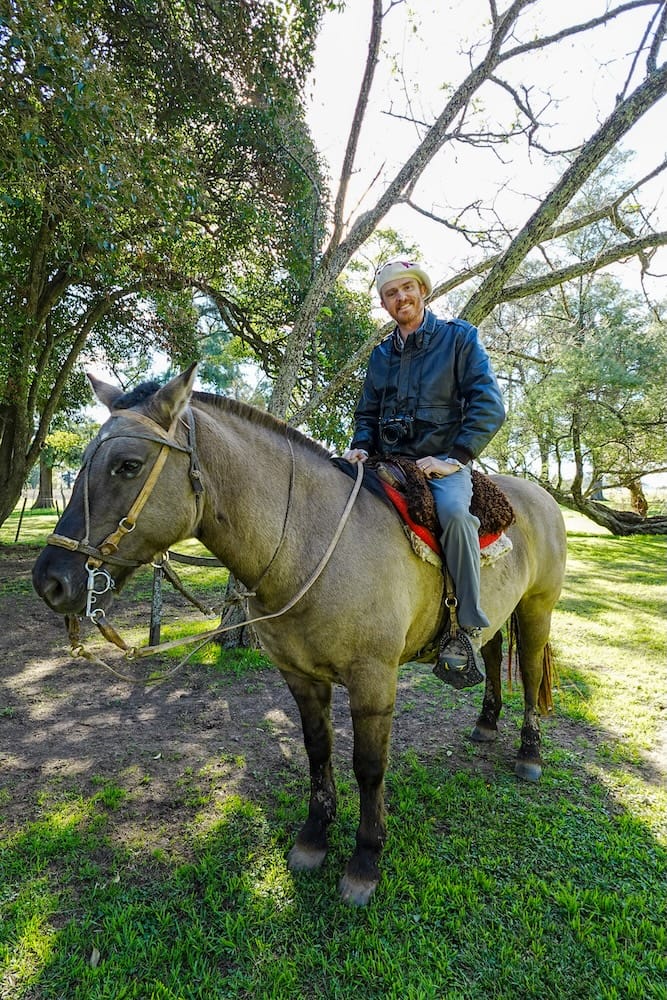 Samuel, wearing a boina, ready for a horse ride at Estancia La Tomasa.