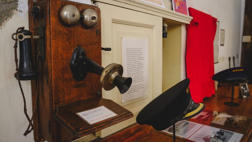 An old phone and a train conductor hat at the Gaiman Regional History Museum housed in the former train station.