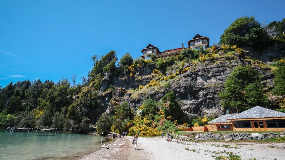 Views of Isla Victoria Lodge, which sits on a cliff overlooking Playa de los Toros on Victoria Island, Bariloche.